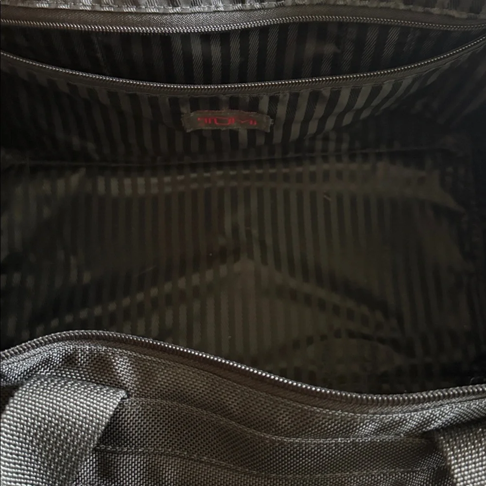 Tumi Black Men's Duffel with Red Logo Luggage Tag